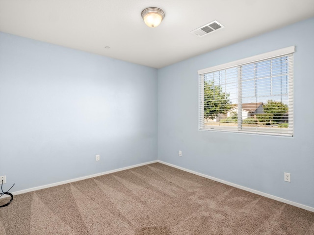 703 Tulip Cir, Dinuba, CA 93618 - carpeted spare room with baseboards