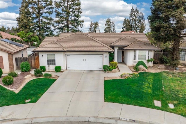 3159 Cedar Creek Ln, Madera, CA 93637 - view of front of house with an attached garage, a tile roof, concrete driveway, stucco siding, and a chimney