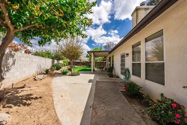 3159 Cedar Creek Ln, Madera, CA 93637 - fenced backyard featuring a patio