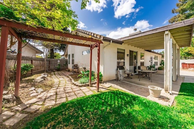 3159 Cedar Creek Ln, Madera, CA 93637 - back of property featuring a patio, a fenced backyard, and stucco siding