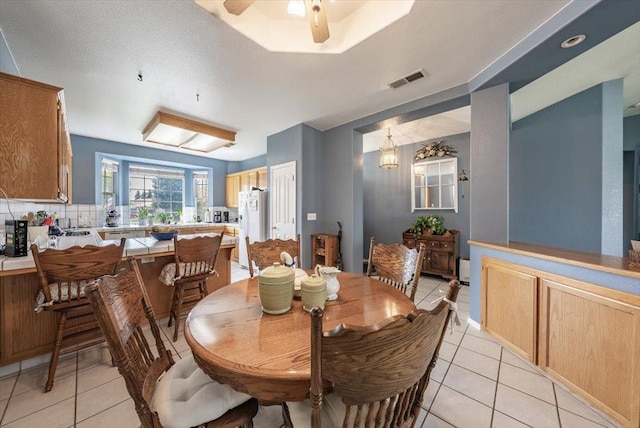 3159 Cedar Creek Ln, Madera, CA 93637 - dining space with light tile patterned flooring and ceiling fan