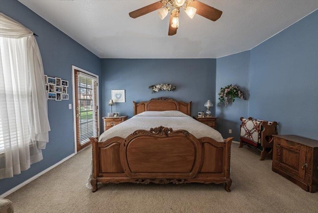 3159 Cedar Creek Ln, Madera, CA 93637 - bedroom featuring light colored carpet, access to exterior, a ceiling fan, and baseboards