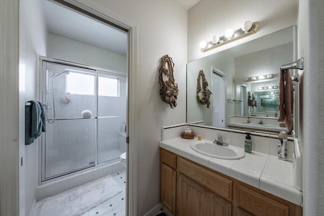 3159 Cedar Creek Ln, Madera, CA 93637 - full bathroom featuring vanity, a shower stall, and toilet