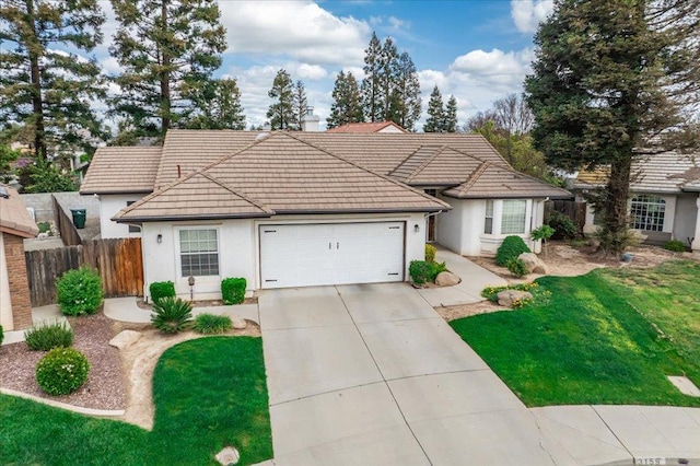 3159 Cedar Creek Ln, Madera, CA 93637 - view of front of home featuring a tile roof, an attached garage, concrete driveway, and stucco siding