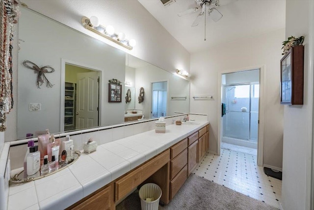 3159 Cedar Creek Ln, Madera, CA 93637 - full bath featuring a shower stall, double vanity, tile patterned floors, ceiling fan, and a walk in closet