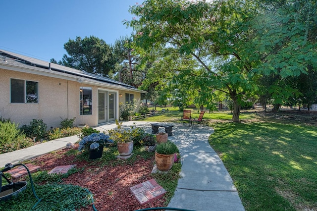 1183 E Dinuba Ave, Fresno, CA 93725 - view of green lawn with french doors and a patio area