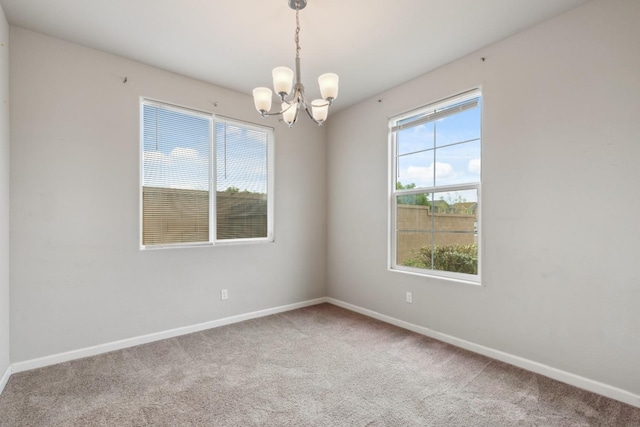 2830 Leanna Ave, Fresno, CA 93737 - unfurnished room with a chandelier, carpet, and baseboards