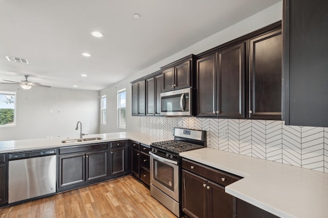2830 Leanna Ave, Fresno, CA 93737 - kitchen with stainless steel appliances, a sink, plenty of natural light, a ceiling fan, and recessed lighting