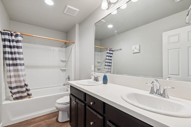 2830 Leanna Ave, Fresno, CA 93737 - bathroom featuring shower / tub combo with curtain, wood finished floors, double vanity, toilet, and recessed lighting