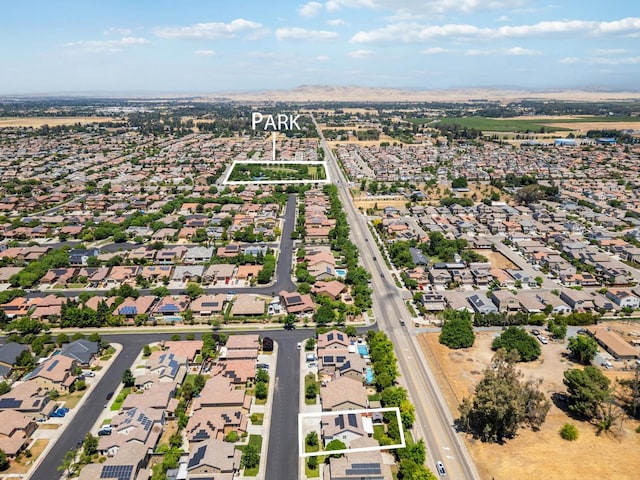 1697 Whiteash Ave, Clovis, CA 93619 - aerial overview of property's location featuring nearby suburban area and property parcel outlined