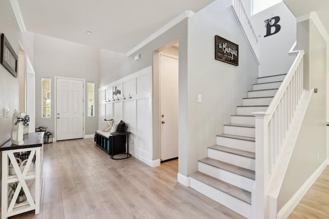1697 Whiteash Ave, Clovis, CA 93619 - entrance foyer featuring stairway, light wood finished floors, ornamental molding, and baseboards