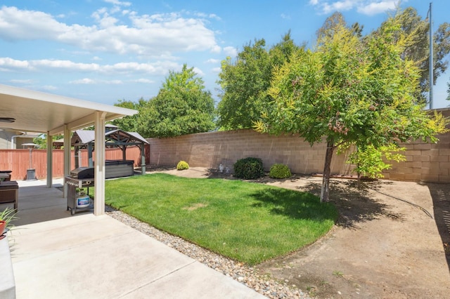 1697 Whiteash Ave, Clovis, CA 93619 - view of yard featuring a hot tub, a patio, and a gazebo