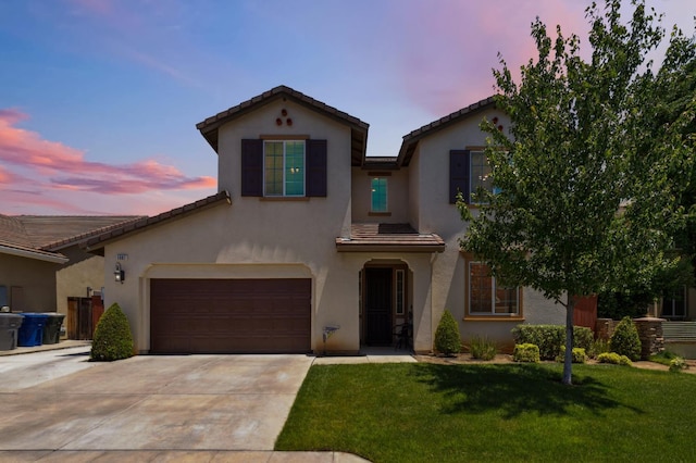 1697 Whiteash Ave, Clovis, CA 93619 - mediterranean / spanish house featuring driveway, a tile roof, a lawn, and stucco siding