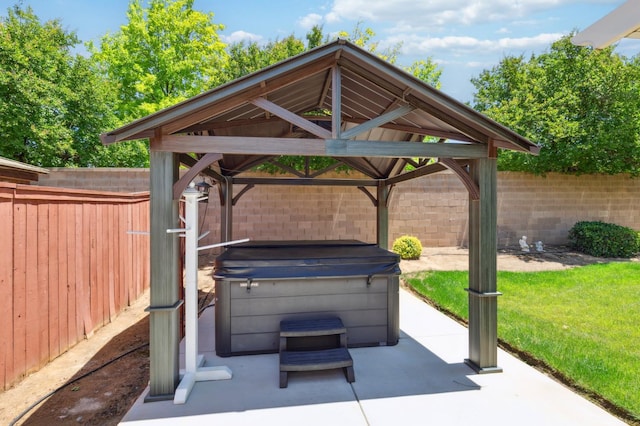 1697 Whiteash Ave, Clovis, CA 93619 - fenced backyard with a hot tub, a gazebo, and a patio area