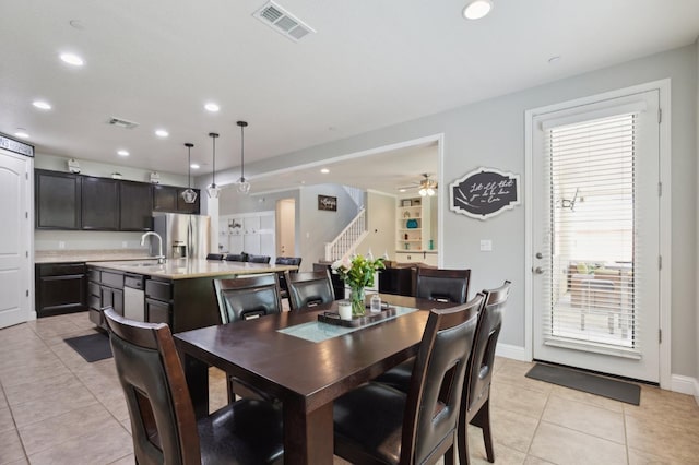 1697 Whiteash Ave, Clovis, CA 93619 - dining area featuring stairs, light tile patterned flooring, recessed lighting, and baseboards