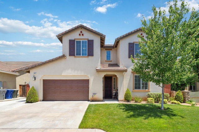 1697 Whiteash Ave, Clovis, CA 93619 - mediterranean / spanish-style home with driveway, a front yard, a tile roof, and stucco siding