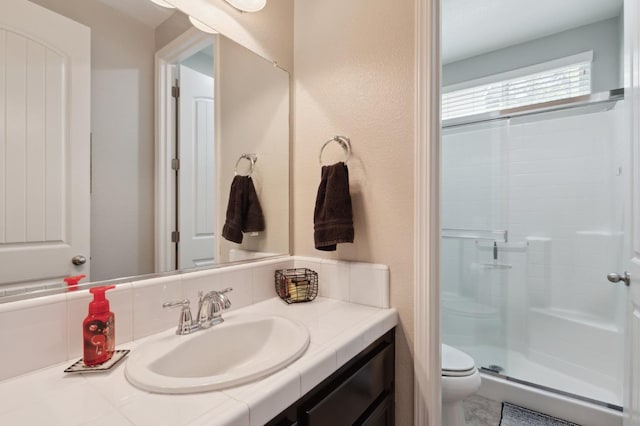 1697 Whiteash Ave, Clovis, CA 93619 - full bathroom with toilet, vanity, and a stall shower
