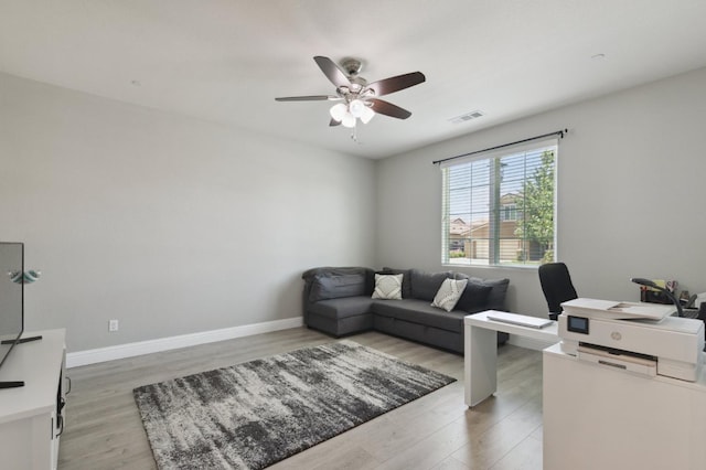 1697 Whiteash Ave, Clovis, CA 93619 - home office featuring ceiling fan, light wood-type flooring, and baseboards
