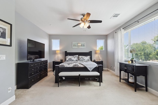 1697 Whiteash Ave, Clovis, CA 93619 - bedroom with light colored carpet, multiple windows, and baseboards