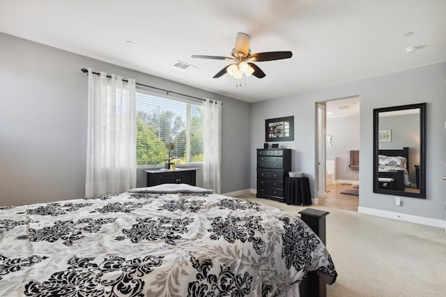 1697 Whiteash Ave, Clovis, CA 93619 - bedroom featuring light colored carpet, baseboards, ceiling fan, and ensuite bath