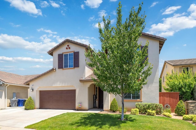 1697 Whiteash Ave, Clovis, CA 93619 - mediterranean / spanish-style home featuring a tile roof, a front lawn, driveway, and stucco siding