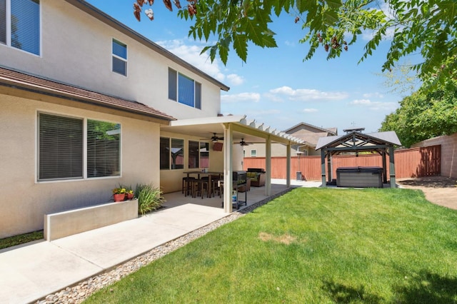 1697 Whiteash Ave, Clovis, CA 93619 - view of yard with a hot tub, ceiling fan, and a patio