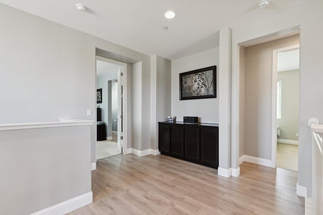 1697 Whiteash Ave, Clovis, CA 93619 - corridor with light wood-type flooring and baseboards