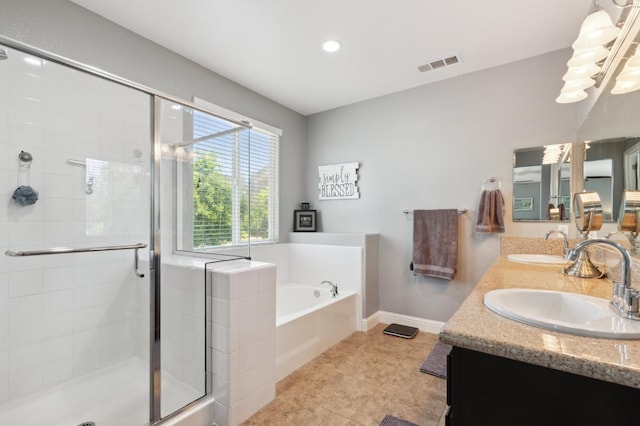 1697 Whiteash Ave, Clovis, CA 93619 - full bath with double vanity, a stall shower, a garden tub, baseboards, and recessed lighting
