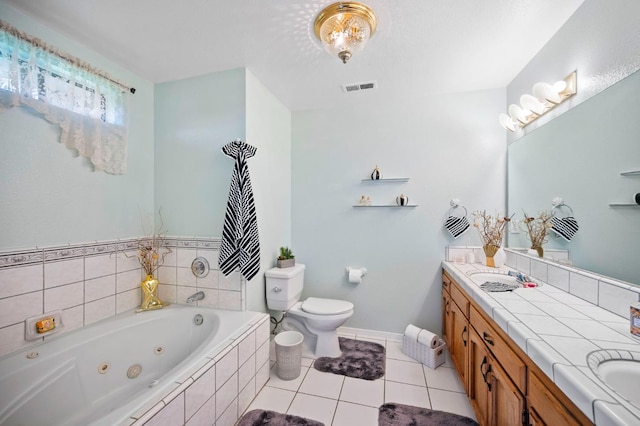 18118 Rd 26, Madera, CA 93638 - bathroom featuring double vanity, toilet, a jetted tub, tile patterned floors, and baseboards