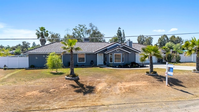 18118 Rd 26, Madera, CA 93638 - single story home with a tile roof, driveway, an attached garage, and a chimney