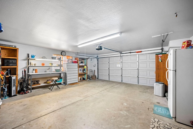 18118 Rd 26, Madera, CA 93638 - garage with freestanding refrigerator and a garage door opener