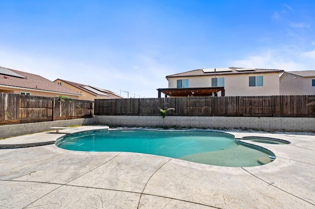 2718 Fern Ct, Selma, CA 93662 - view of swimming pool with a patio, a fenced backyard, a pool with connected hot tub, and a diving board