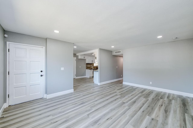 153 Birch, Fresno, CA 93650 - unfurnished living room with recessed lighting, light wood-style flooring, and baseboards