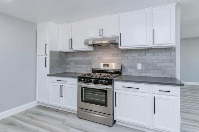 153 Birch, Fresno, CA 93650 - kitchen featuring gas stove, under cabinet range hood, baseboards, and light wood-style flooring