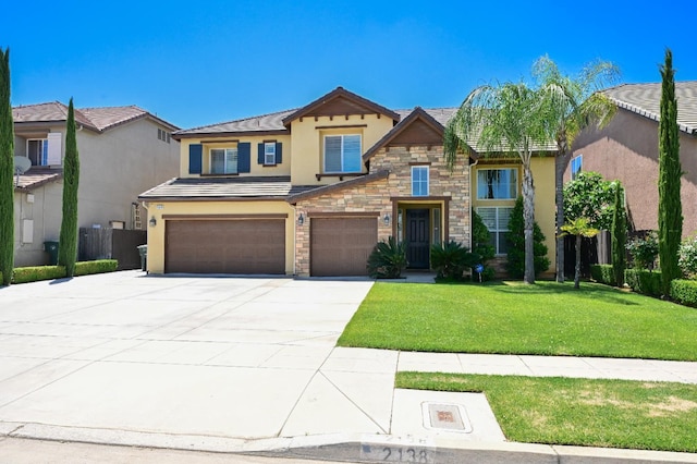 2138 El Paso Ave, Clovis, CA 93611 - view of front of home with stucco siding, an attached garage, driveway, stone siding, and a tile roof
