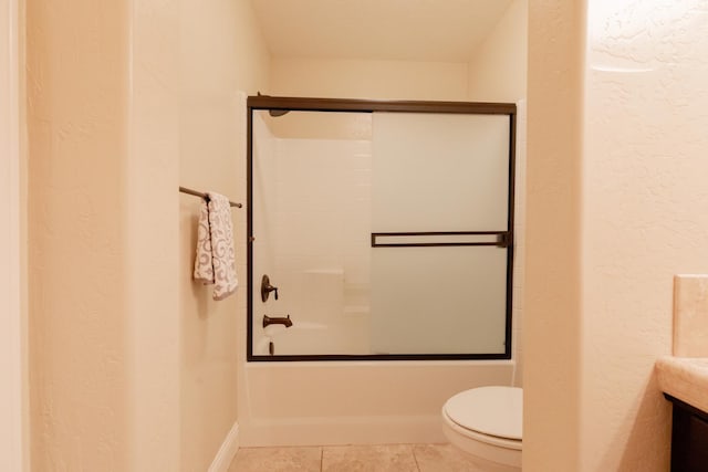 2138 El Paso Ave, Clovis, CA 93611 - bathroom with toilet, shower / bath combination with glass door, vanity, a textured wall, and tile patterned floors