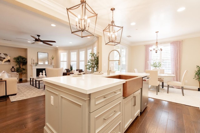 2138 El Paso Ave, Clovis, CA 93611 - kitchen with crown molding, a chandelier, plenty of natural light, recessed lighting, and stainless steel dishwasher