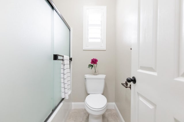 2138 El Paso Ave, Clovis, CA 93611 - bathroom with toilet, baseboards, and tile patterned flooring