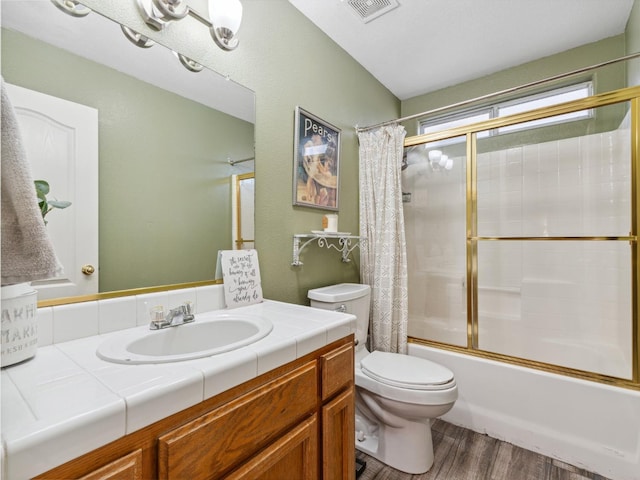 279 Lily Ave, Sanger, CA 93657 - bathroom with toilet, vanity, shower / bath combination with glass door, and wood finished floors