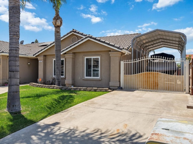 279 Lily Ave, Sanger, CA 93657 - view of front of house with stucco siding, a tile roof, a carport, a gate, and driveway
