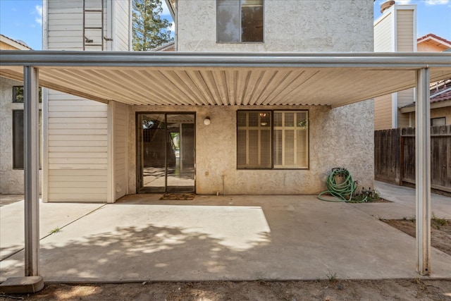 473 E Alluvial Ave Unit 107, Fresno, CA 93720 - rear view of property featuring stucco siding and a patio