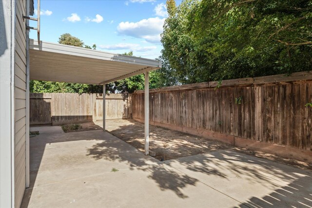 473 E Alluvial Ave Unit 107, Fresno, CA 93720 - fenced backyard with a patio area