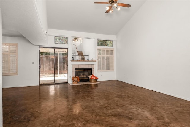 473 E Alluvial Ave Unit 107, Fresno, CA 93720 - unfurnished living room featuring ceiling fan, concrete floors, a tile fireplace, baseboards, and lofted ceiling