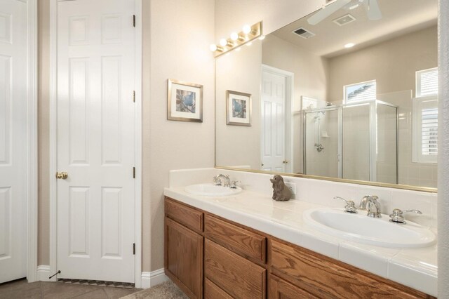 1752 Magnolia, Clovis, CA 93619 - bathroom with a stall shower, double vanity, and tile patterned flooring