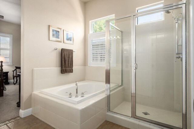 1752 Magnolia, Clovis, CA 93619 - bathroom with a bath, a shower stall, and baseboards