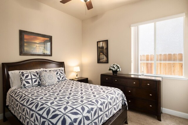 1752 Magnolia, Clovis, CA 93619 - bedroom featuring light carpet, baseboards, and a ceiling fan