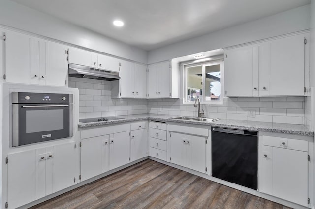 4881 E Rialto Ave, Fresno, CA 93726 - kitchen with black appliances, under cabinet range hood, a sink, white cabinetry, and tasteful backsplash
