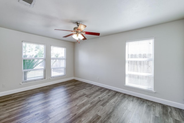 8259 N College Ave, Fresno, CA 93711 - spare room with baseboards, wood finished floors, and a ceiling fan