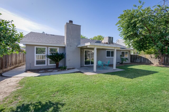 8259 N College Ave, Fresno, CA 93711 - back of house featuring a chimney, a patio area, stucco siding, and central AC