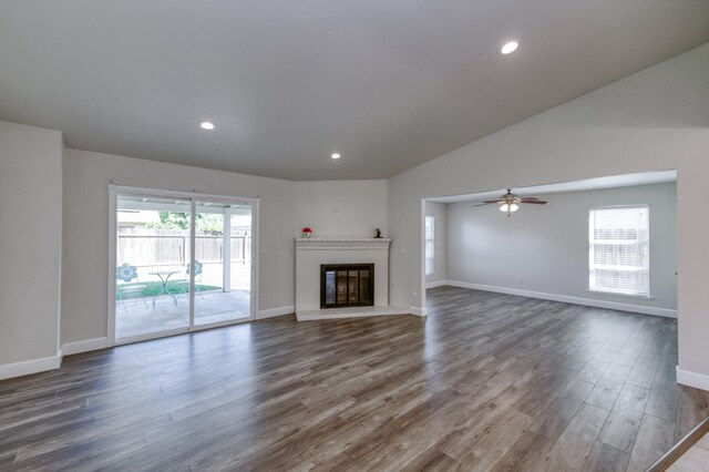 8259 N College Ave, Fresno, CA 93711 - unfurnished living room featuring wood finished floors, baseboards, a ceiling fan, a glass covered fireplace, and lofted ceiling